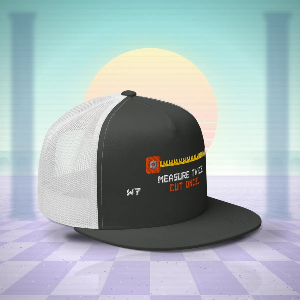 W7 Measure Twice. Cut Once. Trucker Hat in Charcoal/White, a styled photo
